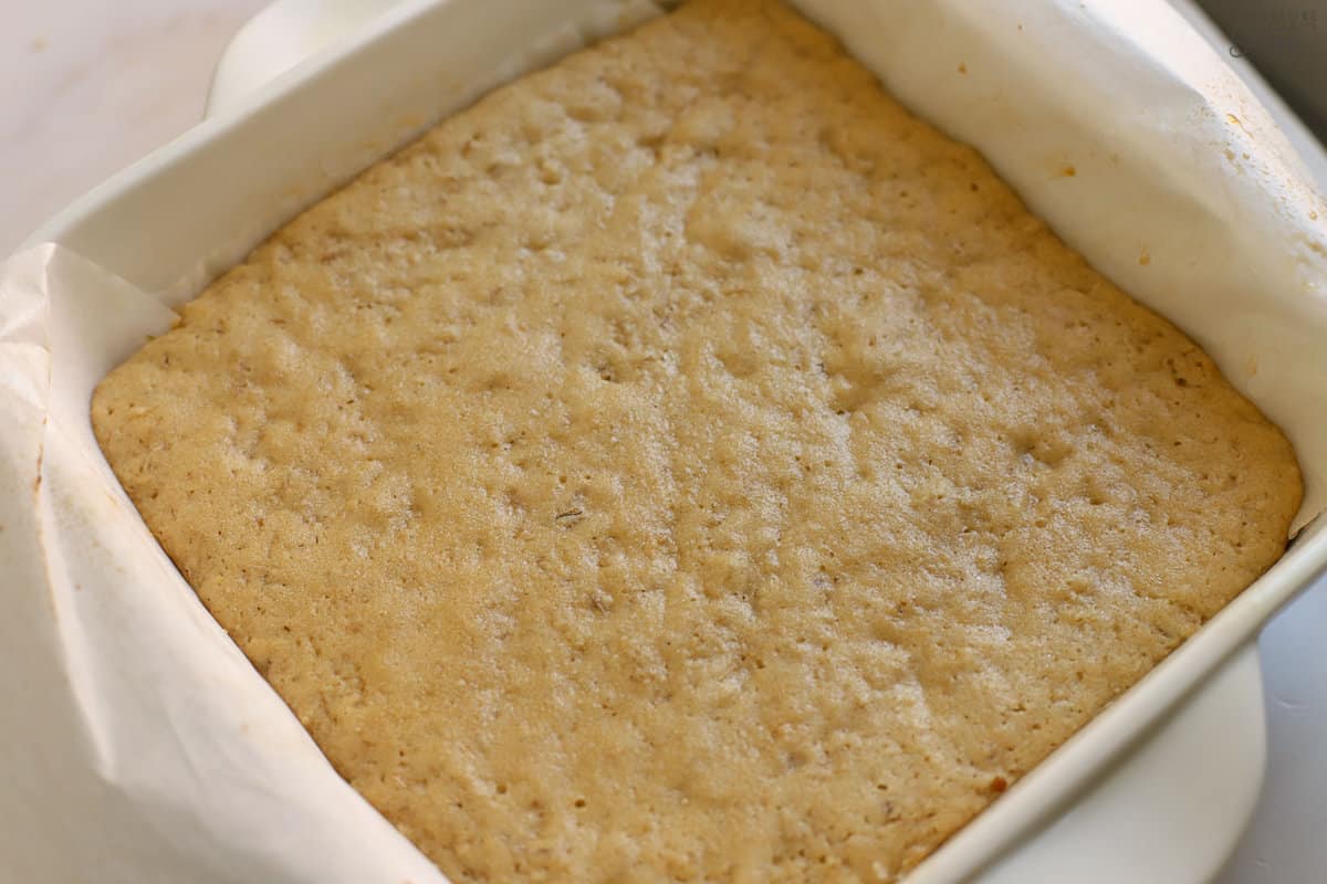 Oatmeal cookie bars in a white square baking dish.
