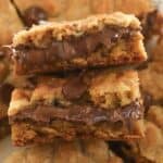 Two pieces of nutella cookie bars stacked on top of each other.