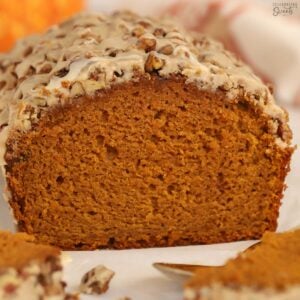 Loaf of pumpkin bread on parchment paper.