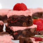 Two strawberry brownies stacked on top of each other.