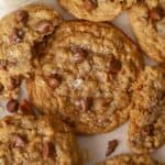Closeup of a cowboy cookie topped with chocolate chips and flaky salt.