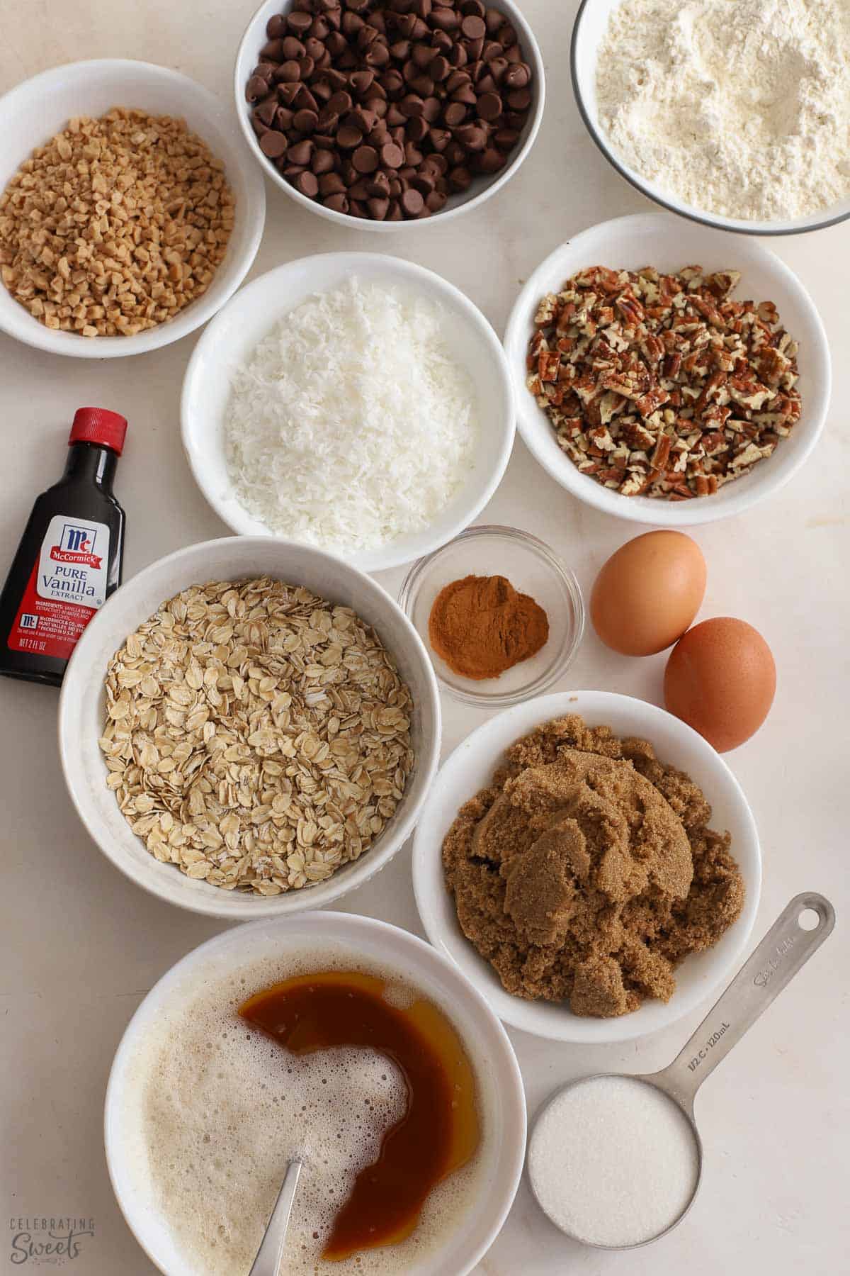 Ingredients for cowboy cookies: flour, sugars, brown butter, eggs, coconut, nuts, chocolate chips.