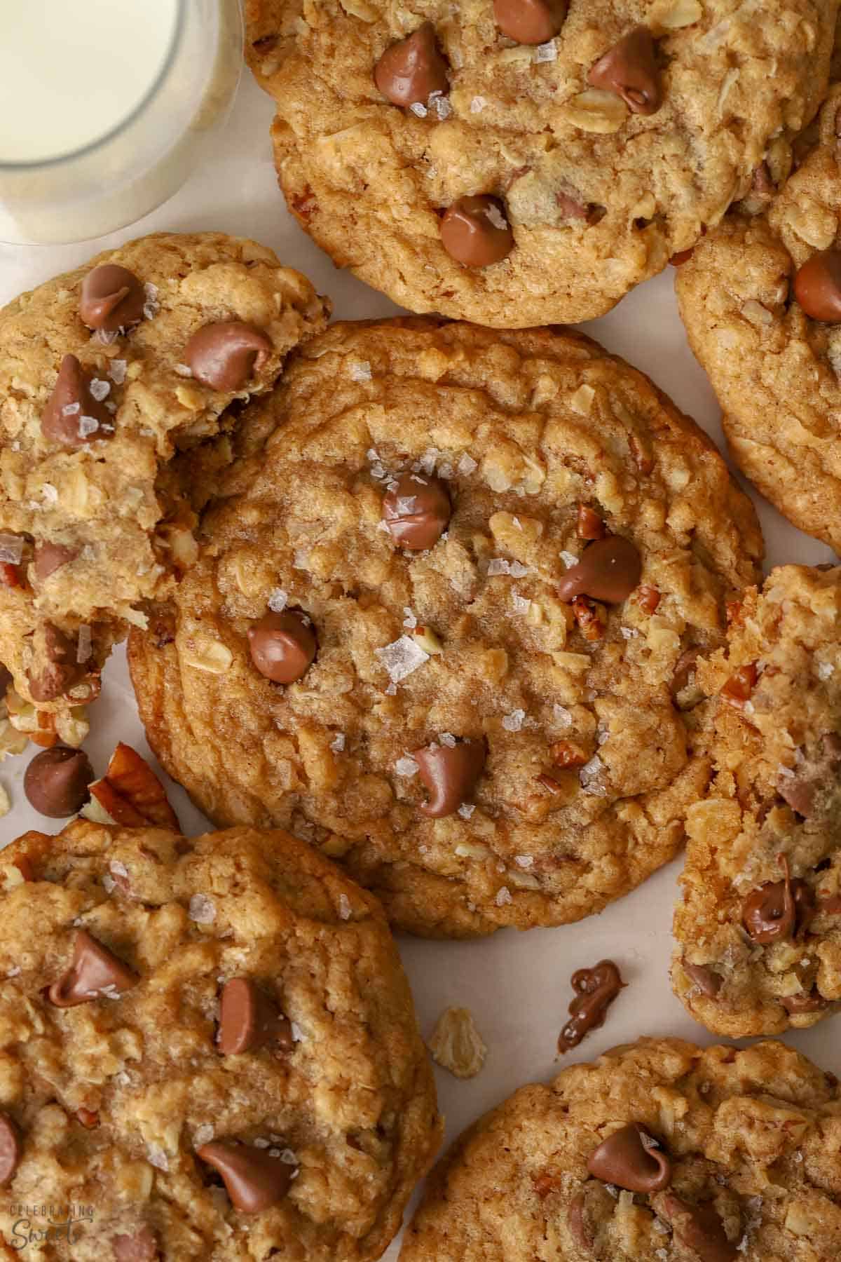 Closeup of a cowboy cookie topped with chocolate chips and flaky salt.