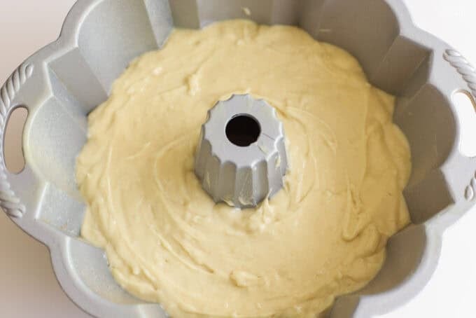 Cake batter in a metal bundt pan.
