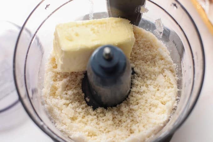 Butter and sugar in a food processor.
