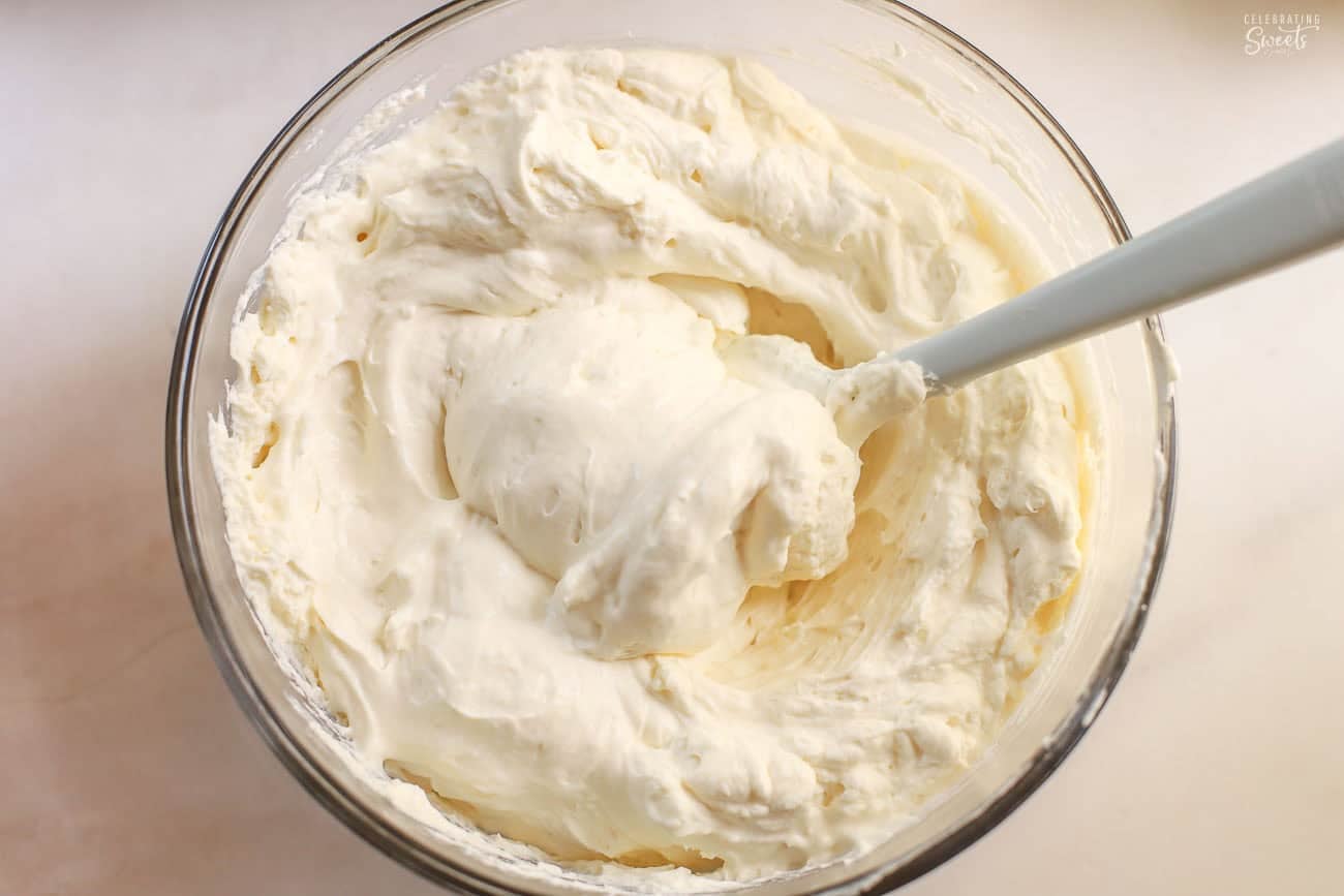 Whipped cream in a glass bowl.